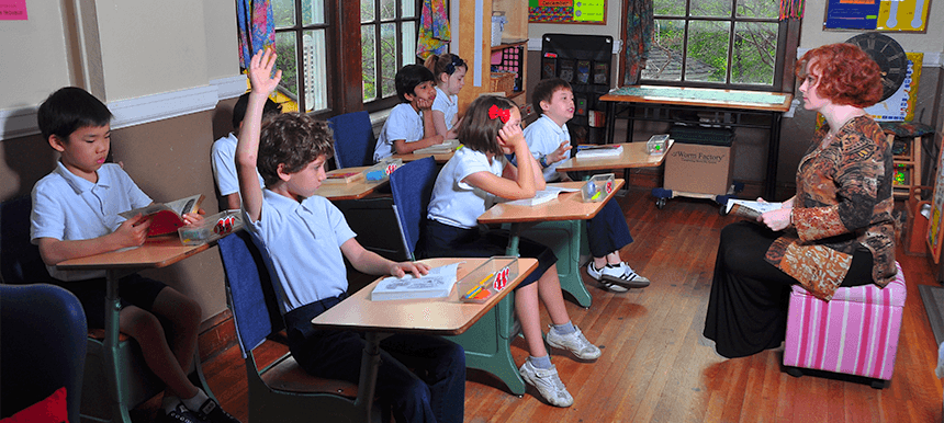 teacher lecturing lower school class