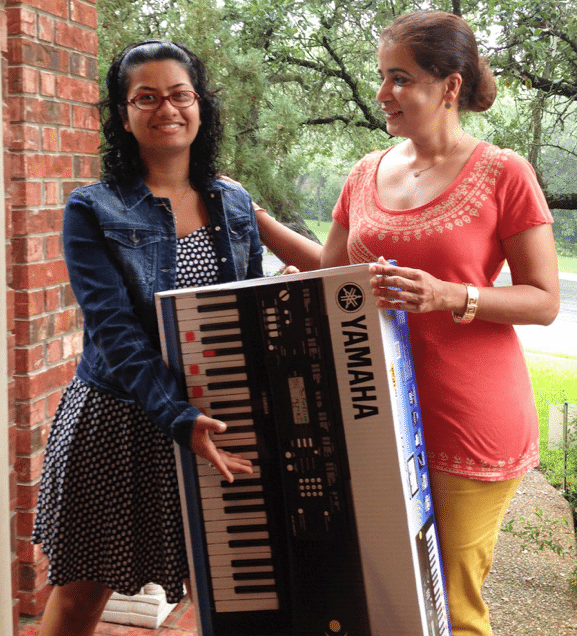 Sonali Mitra donates music equipment to Kirby Hall’s music department