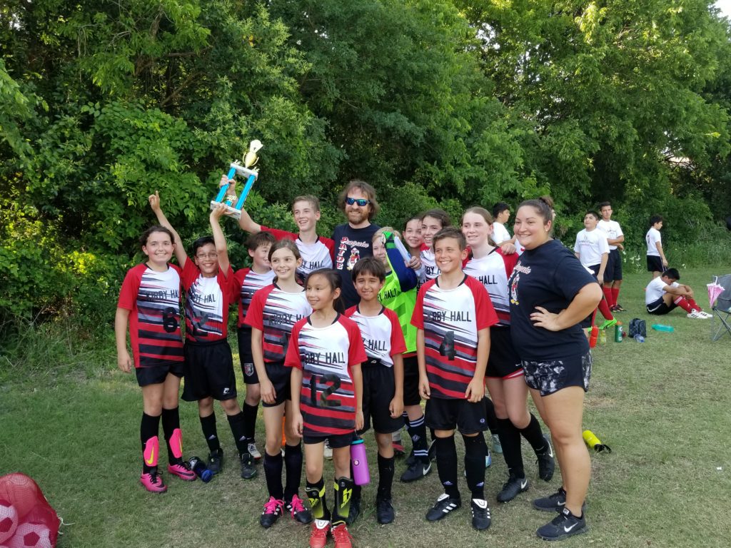 the kirby hall penguins after winning the 2018 soccer championship